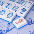 Blue Porcelain Mahjong tiles displayed in clear racks