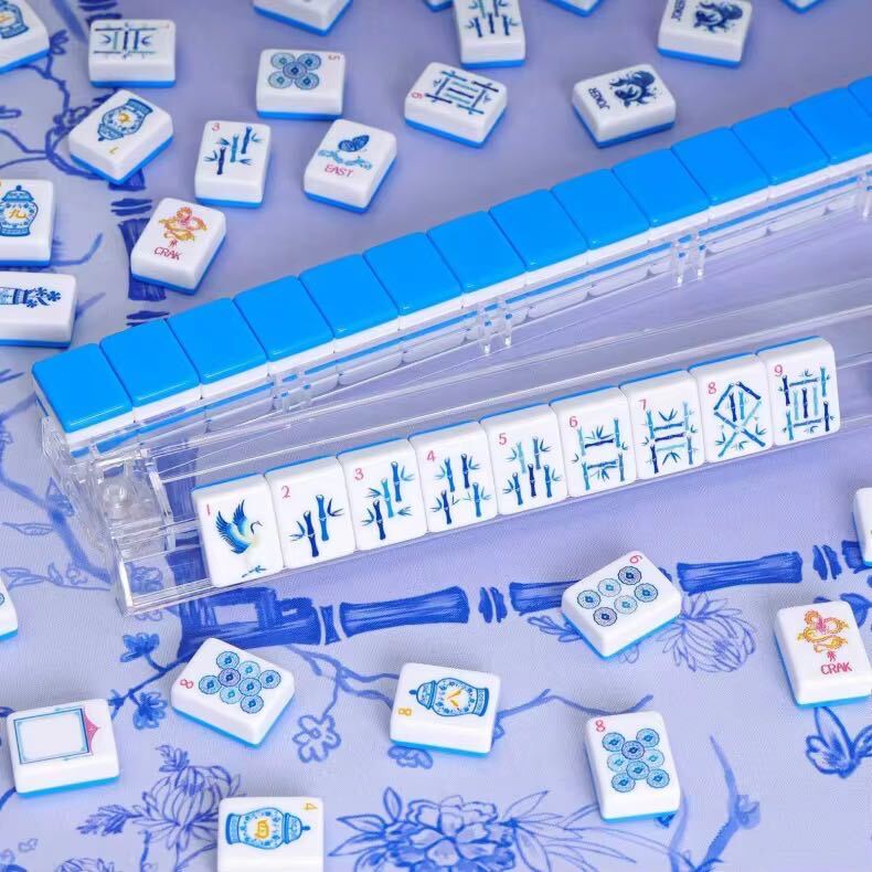 Blue Porcelain Mahjong tiles displayed in clear racks