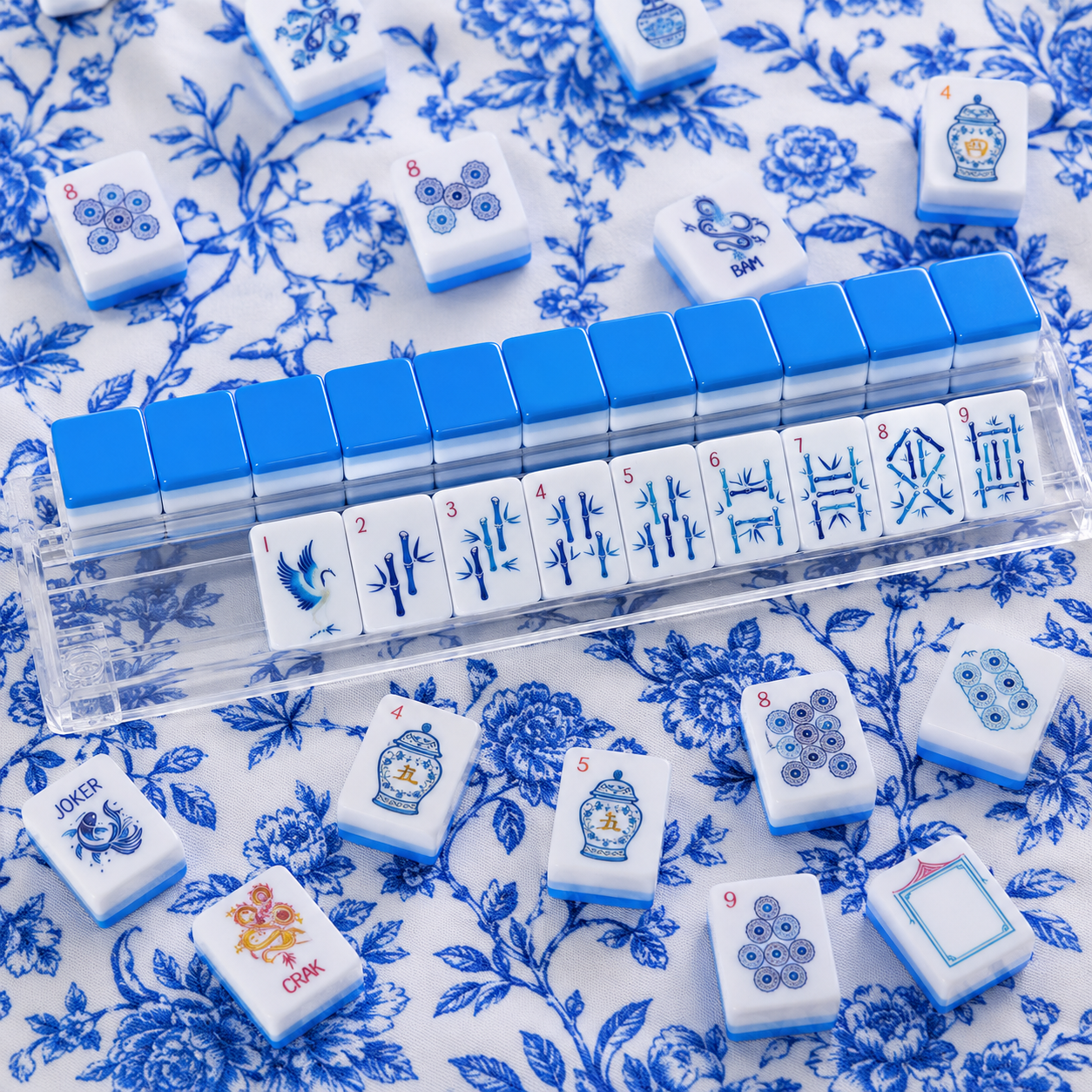 Set of blue and white tiles with Chinese characters on a floral patterned surface