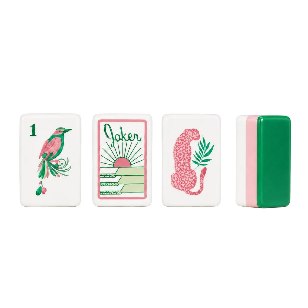 Palm Paradise Mahjong set with tropical pink and green tiles arranged on marble background