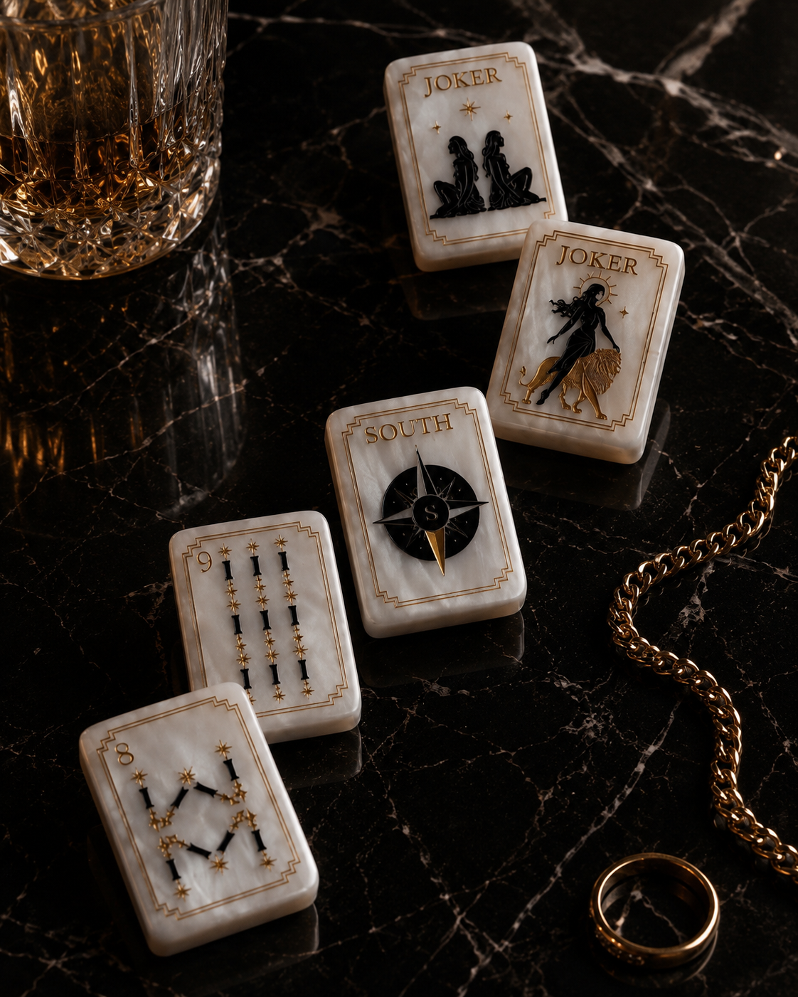 Celestial Pearl Mahjong tiles arranged diagonally on black marble with gold jewelry