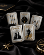 Luxury pearl white Mahjong tiles displayed on black silk with gold celestial details