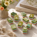 Close-up of green floral Mahjong tiles with tulip, bamboo, and dot artwork