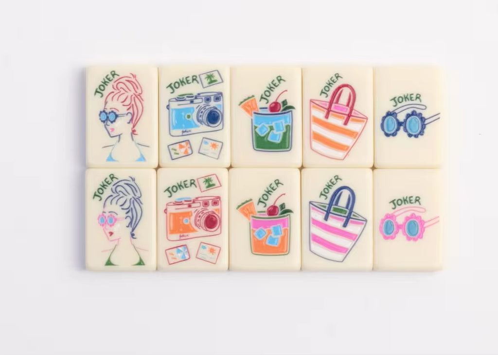 Four tropical American Mahjong tiles featuring toucan, green leaf number tile, joker tile, and blue checker back design