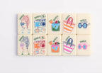 Four tropical American Mahjong tiles featuring toucan, green leaf number tile, joker tile, and blue checker back design