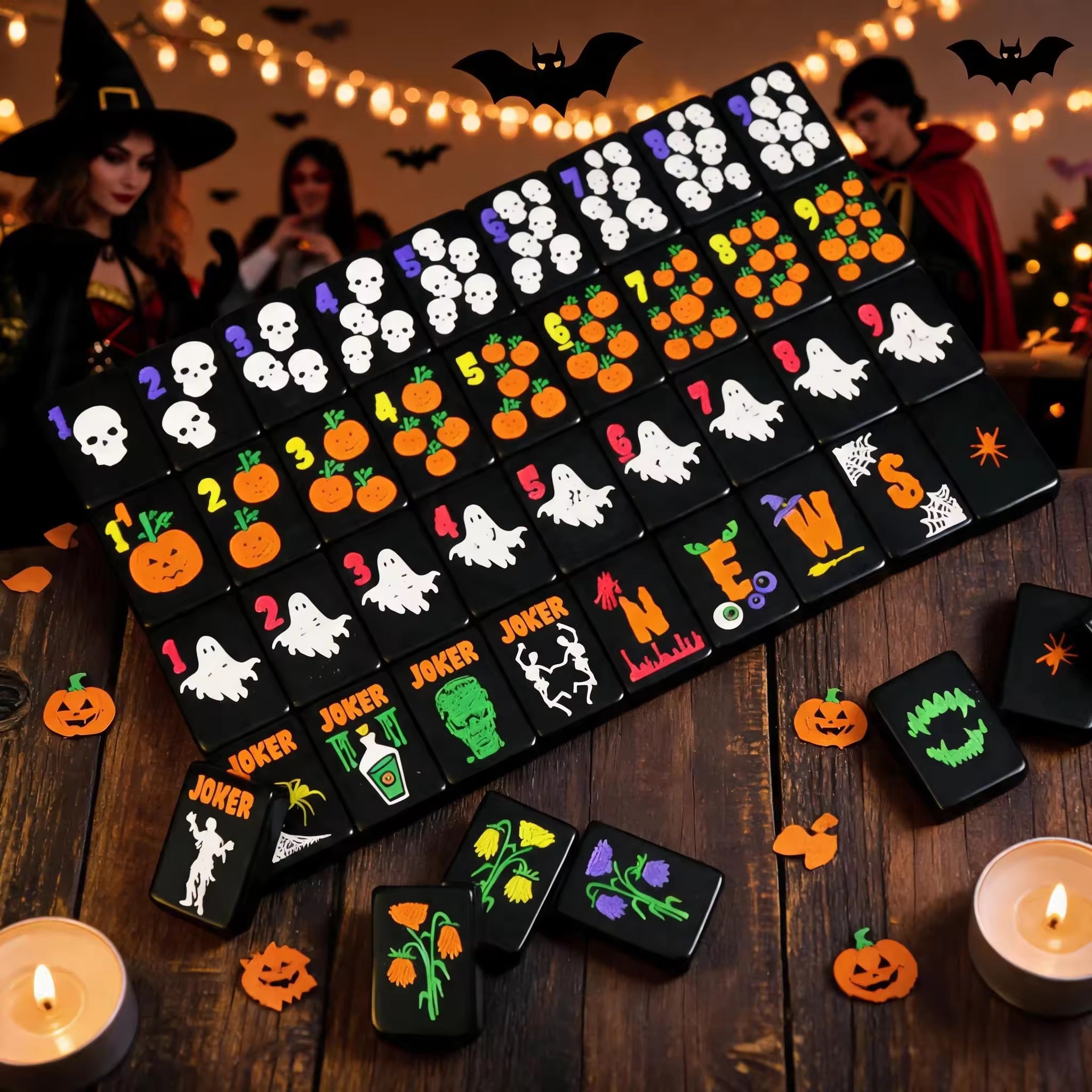 Complete black Halloween mahjong tile set arranged on a wooden table at a festive Halloween party.
